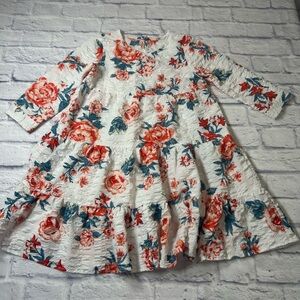 Franchesca’s Miami Little Girls Dress in White and Red Floral. Long
Sleeves.